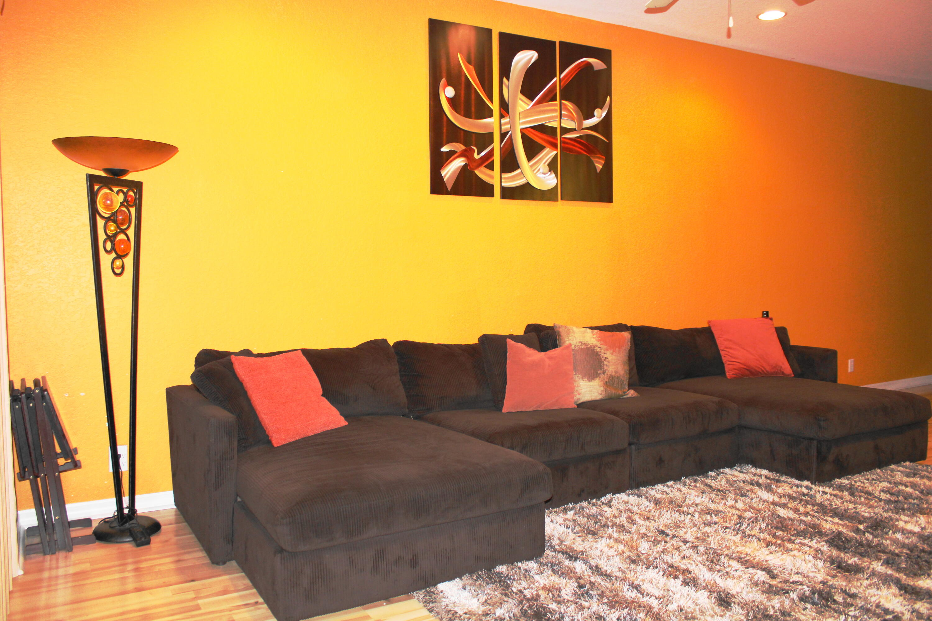 31 Beechdale Lane Boynton Beach, FL 33426 - Photo 6 of 26 a living room with a couch and a lamp