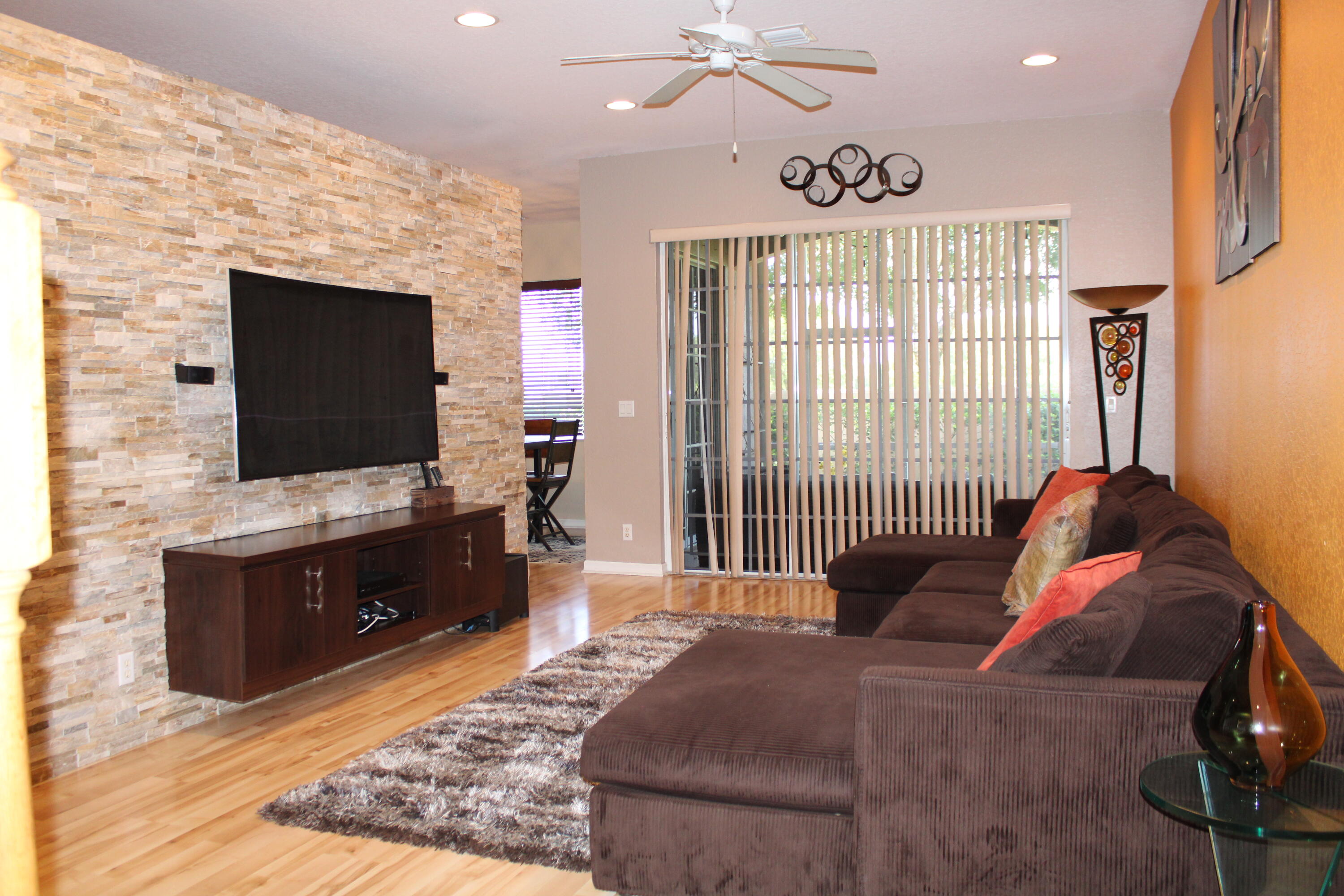 31 Beechdale Lane Boynton Beach, FL 33426 - Photo 7 of 26 a living room with furniture and a flat screen tv