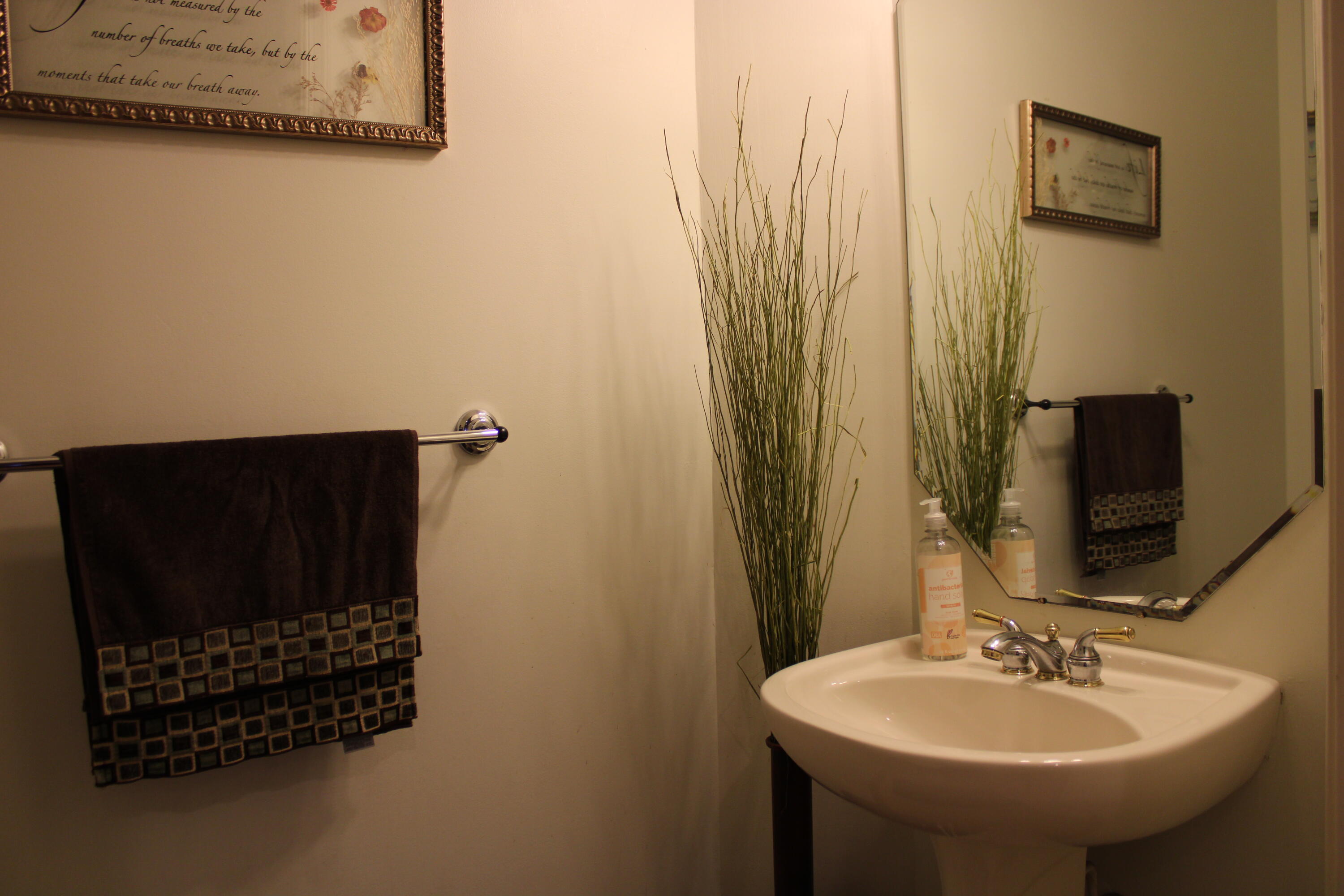 31 Beechdale Lane Boynton Beach, FL 33426 - Photo 8 of 26 a bathroom with a sink and a mirror