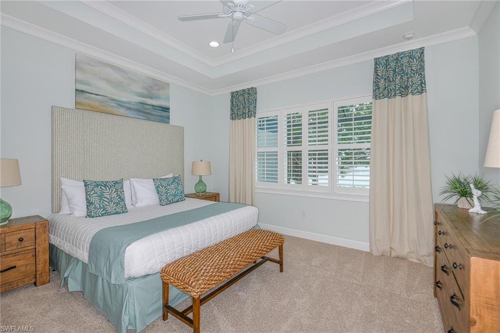 5764 Elbow Avenue Naples, FL 34113 - Photo 15 of 48 a bedroom with a bed and a window