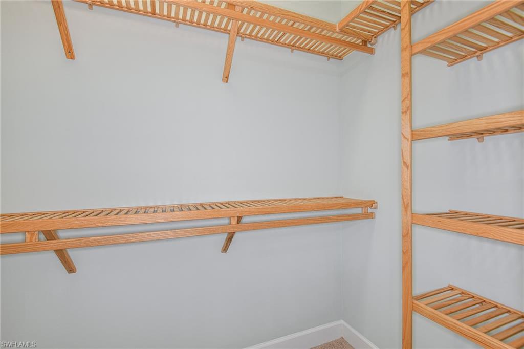 5764 Elbow Avenue Naples, FL 34113 - Photo 19 of 48 a view of a room with racks on the wall