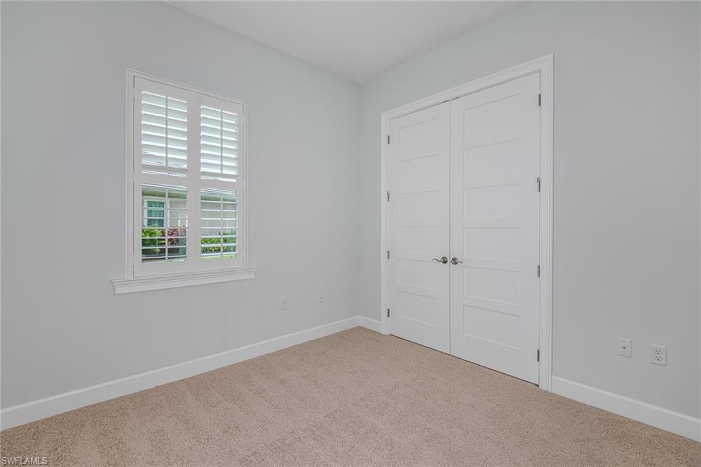 5764 Elbow Avenue Naples, FL 34113 - Photo 23 of 48 an empty room with windows