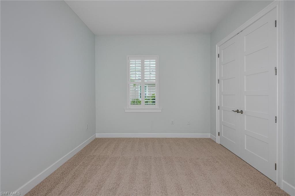 5764 Elbow Avenue Naples, FL 34113 - Photo 24 of 48 a view of an empty room with a window