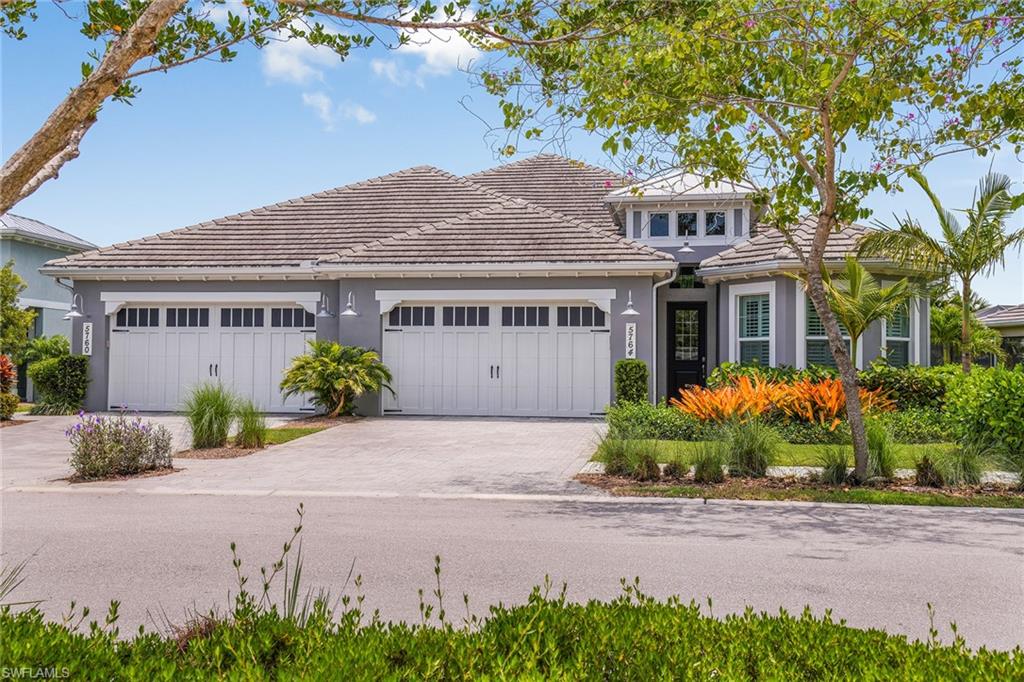 5764 Elbow Avenue Naples, FL 34113 - Photo 29 of 48 front view of a house with a yard