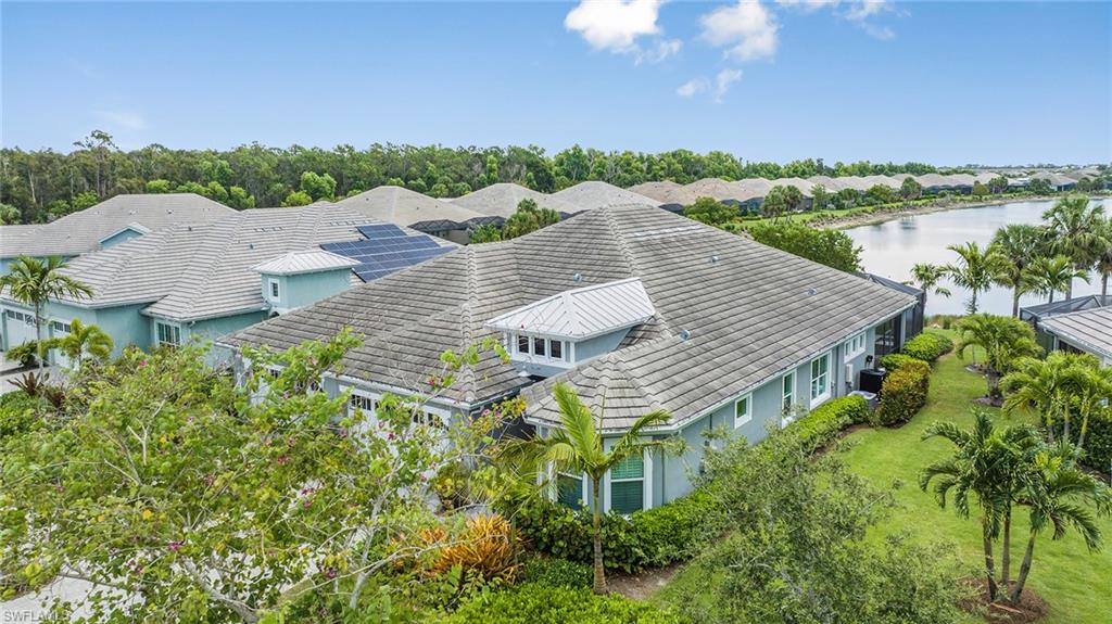 5764 Elbow Avenue Naples, FL 34113 - Photo 44 of 48 an aerial view of house with yard and lake view