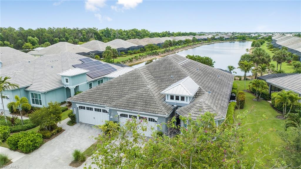 5764 Elbow Avenue Naples, FL 34113 - Photo 45 of 48 an aerial view of a house with a garden and lake view