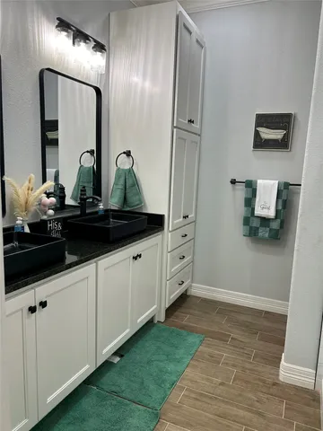 a bathroom with a sink and a mirror