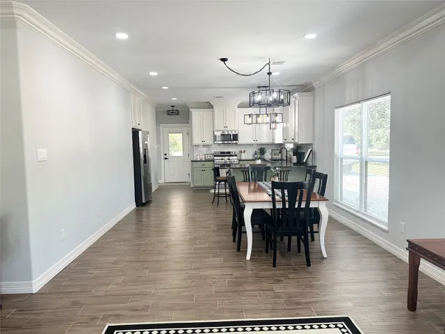 a view of a dining room with furniture