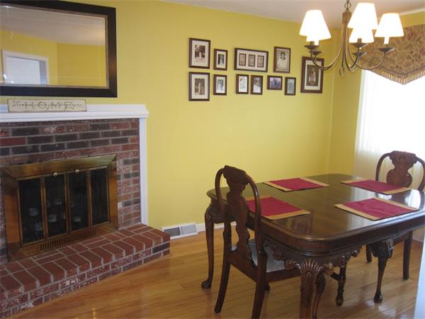 77 Mountain Gate Road, Unit 77 Ashland, MA 01721 - Photo 12 of 20 a view of a dining room with furniture and wooden floor