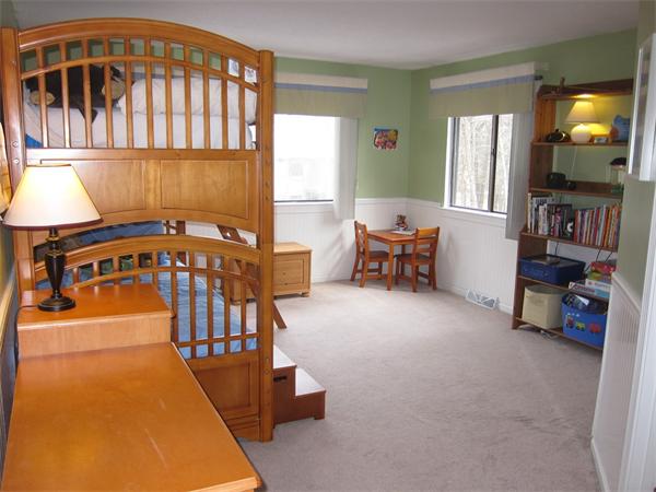 77 Mountain Gate Road, Unit 77 Ashland, MA 01721 - Photo 18 of 20 a view of a livingroom with furniture and toys
