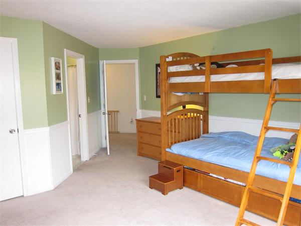 77 Mountain Gate Road, Unit 77 Ashland, MA 01721 - Photo 20 of 20 a view of a bedroom with furniture and window