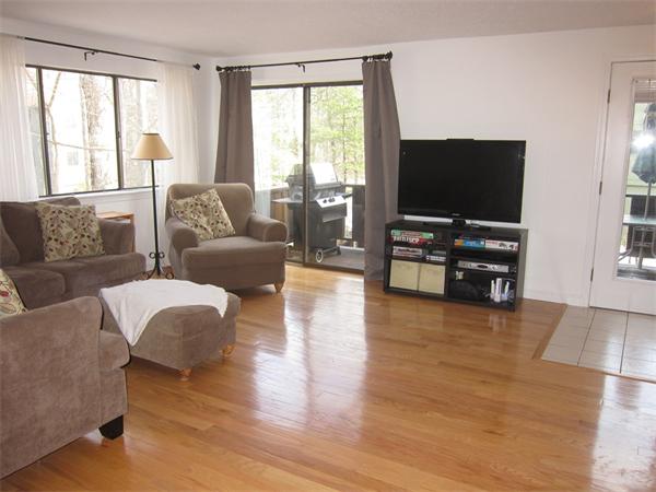 77 Mountain Gate Road, Unit 77 Ashland, MA 01721 - Photo 4 of 20 a living room with furniture and a flat screen tv