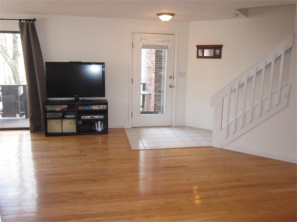 77 Mountain Gate Road, Unit 77 Ashland, MA 01721 - Photo 5 of 20 a view of empty room with wooden floor and windows