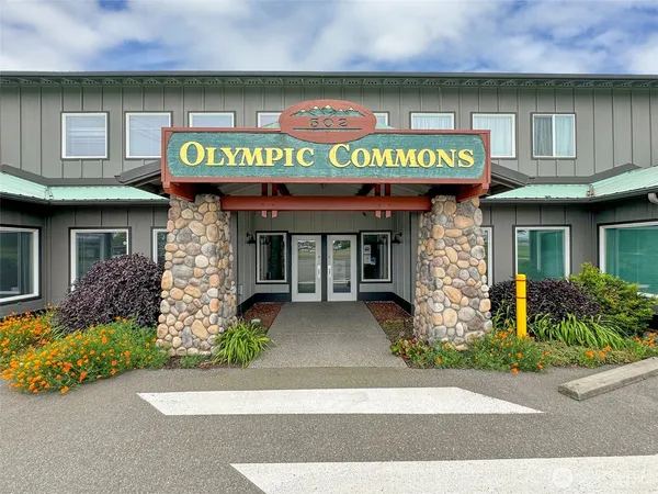 a front view of a building with retail shops