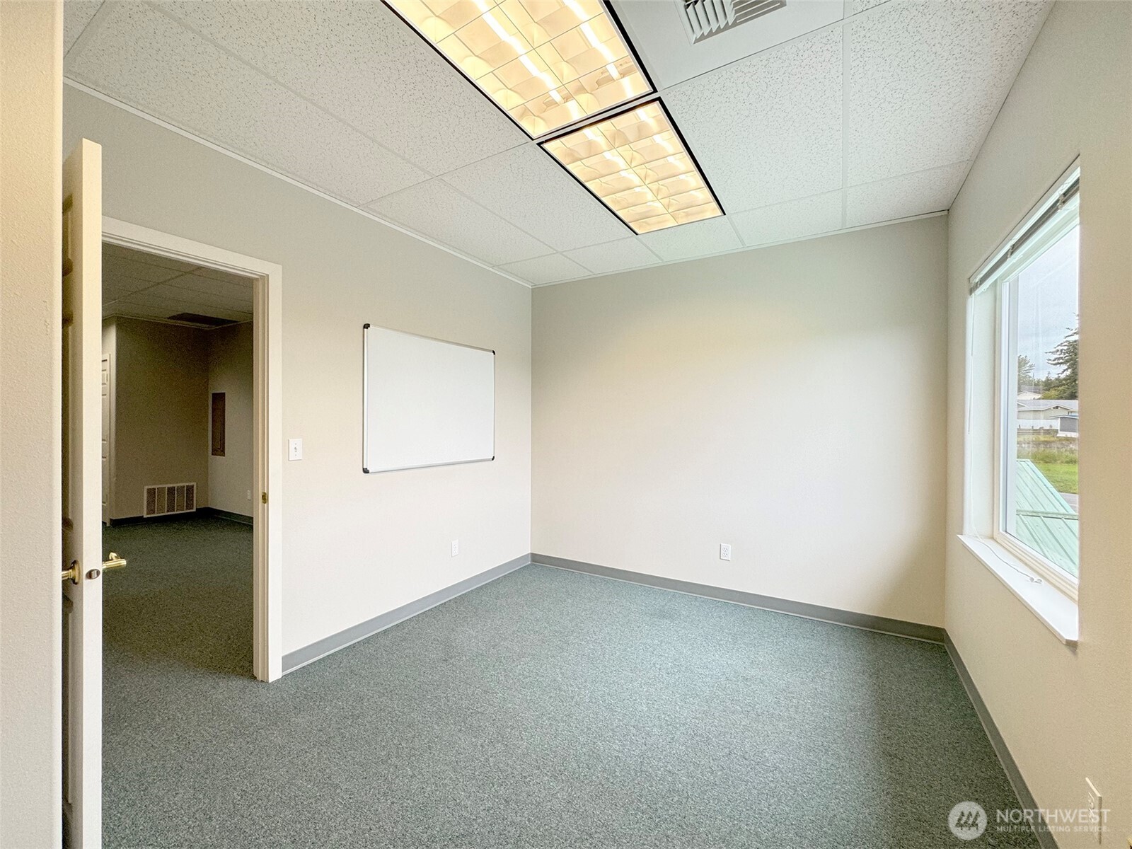 502 South Still Road Sequim, WA 98382 - Photo 25 of 40 an empty room with windows and entrance