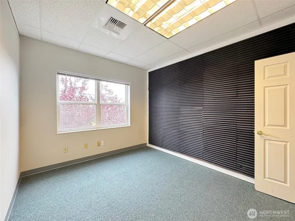 a view of an empty room with a window