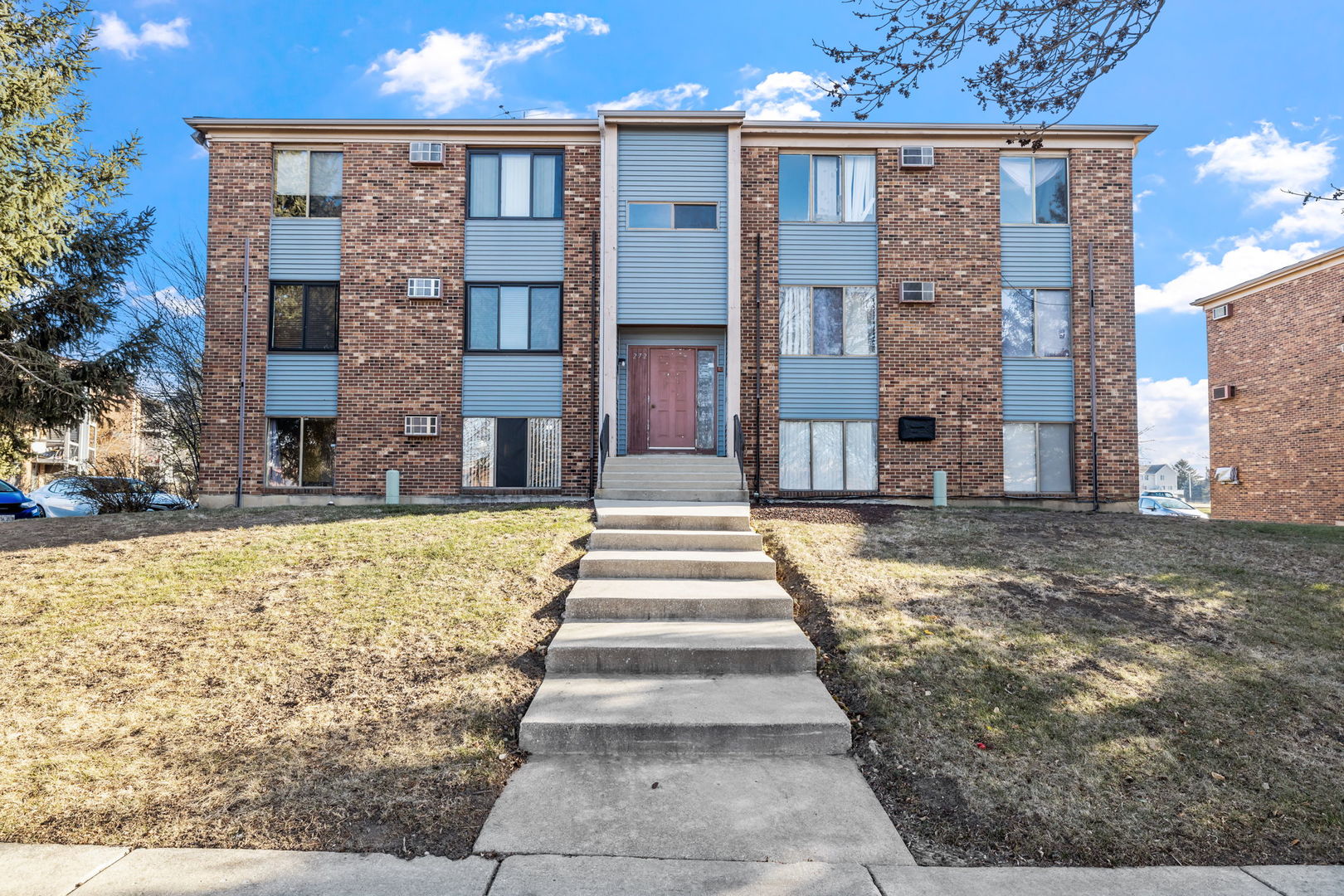 272 Canterbury Lane, Unit 2 Bolingbrook, IL 60440 - Photo 1 of 13 a front view of a building