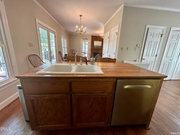 a bathroom with a granite countertop sink a mirror and a toilet
