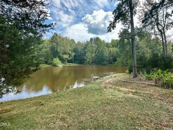 a view of a lake with a building in the background