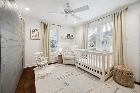 a spacious bedroom with a bed and a table