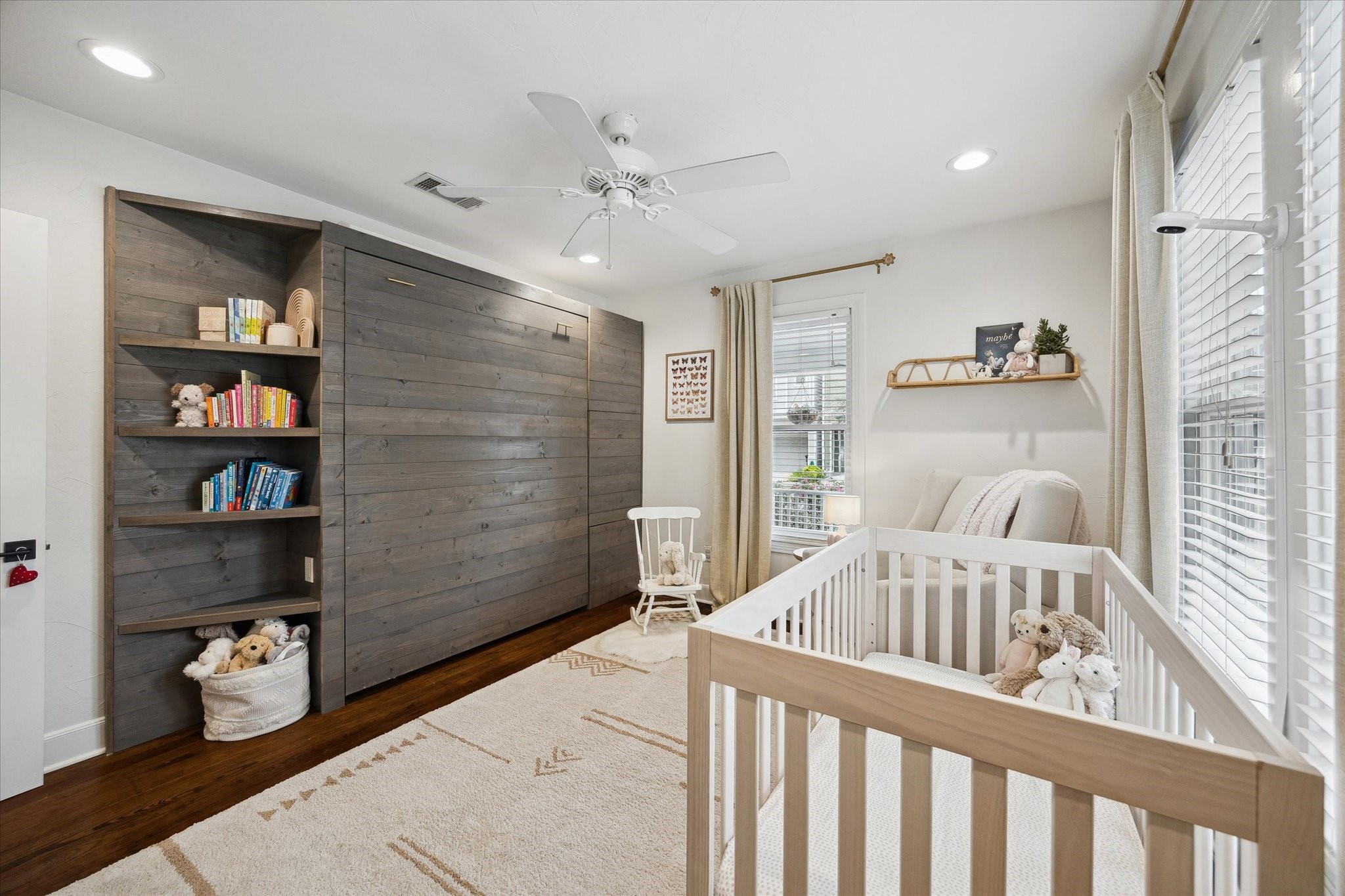 838 East 24th Street Houston, TX 77009 - Photo 12 of 28 a bedroom with furniture and a book shelf