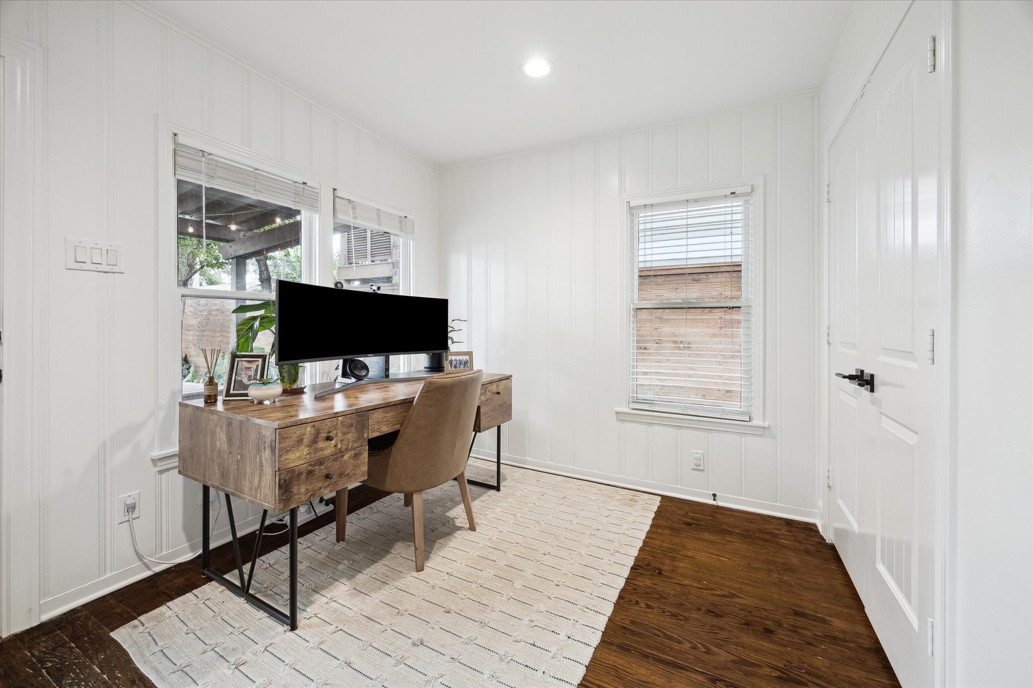 838 East 24th Street Houston, TX 77009 - Photo 19 of 28 a view of a workspace with furniture and wooden floor