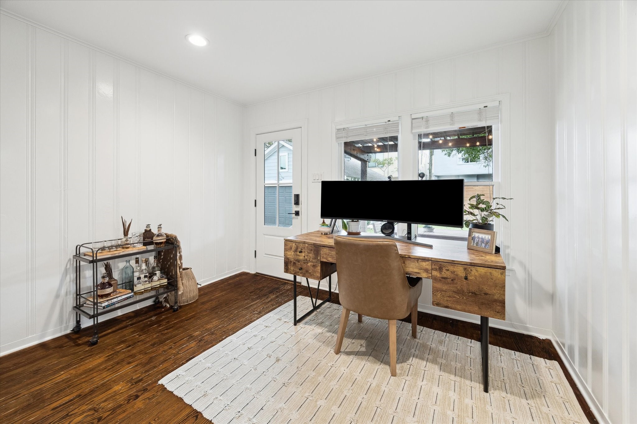 838 East 24th Street Houston, TX 77009 - Photo 20 of 28 a living room with furniture a flat screen tv and a table