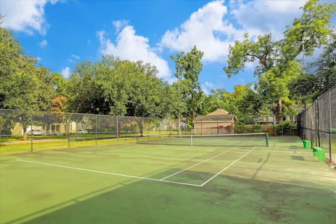 a view of an outdoor space and tennis court