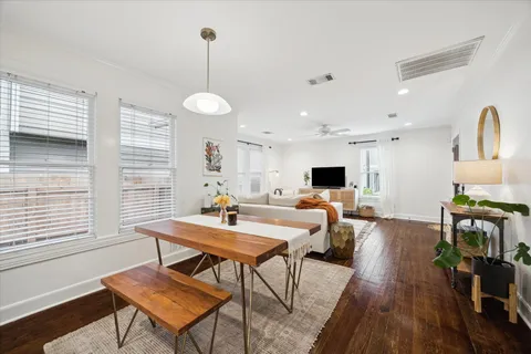 a living room with furniture a window and a table