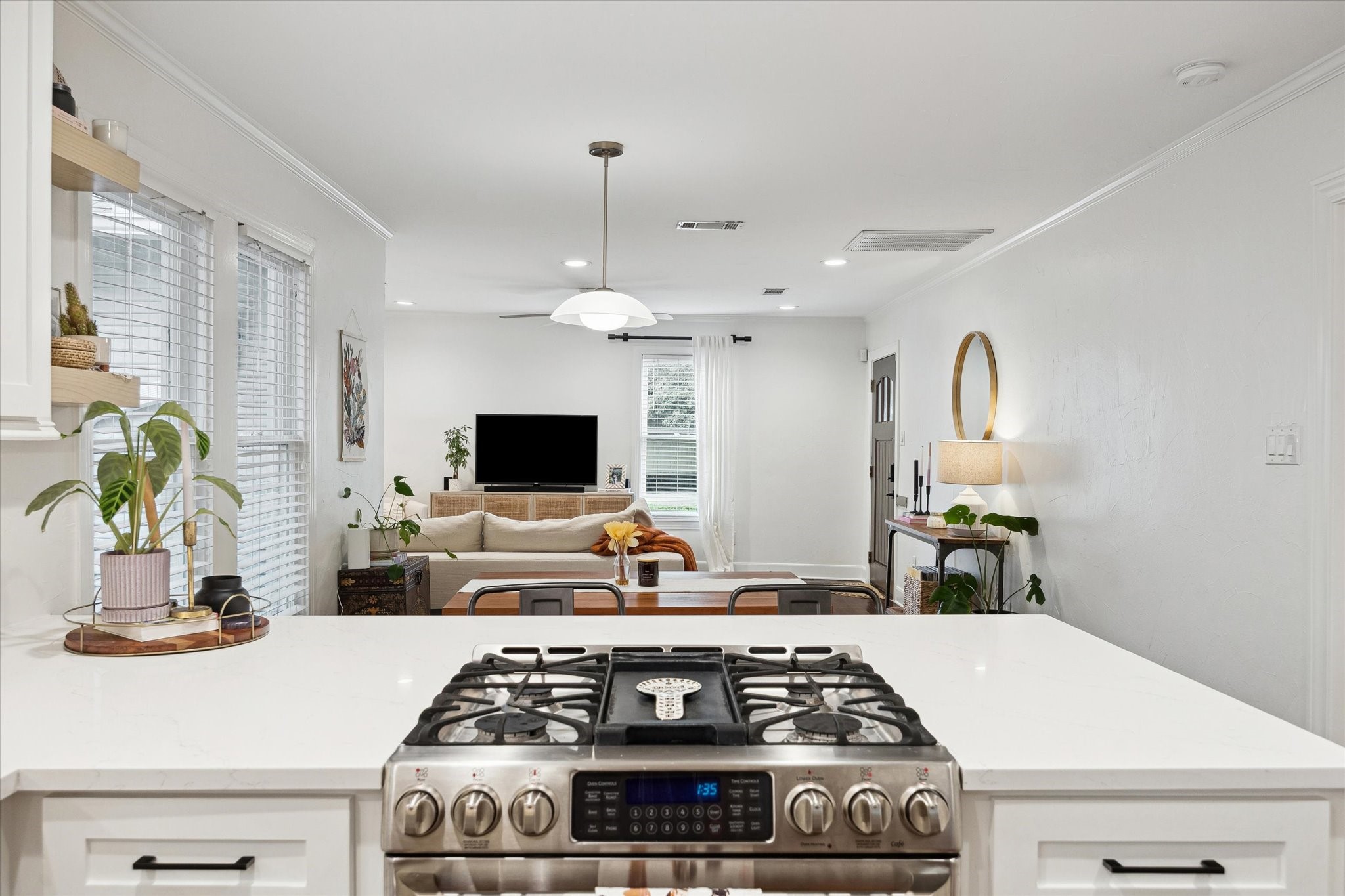 838 East 24th Street Houston, TX 77009 - Photo 10 of 28 a kitchen with a stove and white cabinets