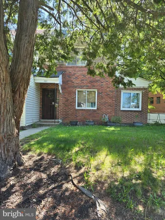 a view of house with backyard