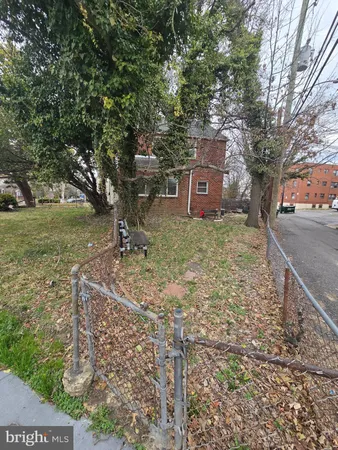 a view of a tree in front of a house