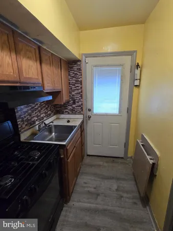 a kitchen with a stove and a microwave
