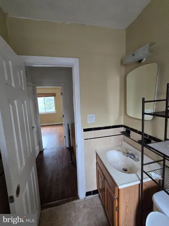 a bathroom with a sink and mirror