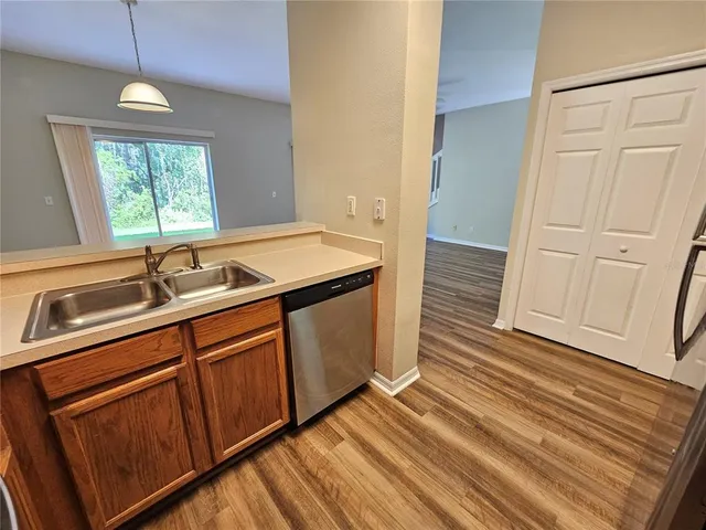 a kitchen with a sink and a window