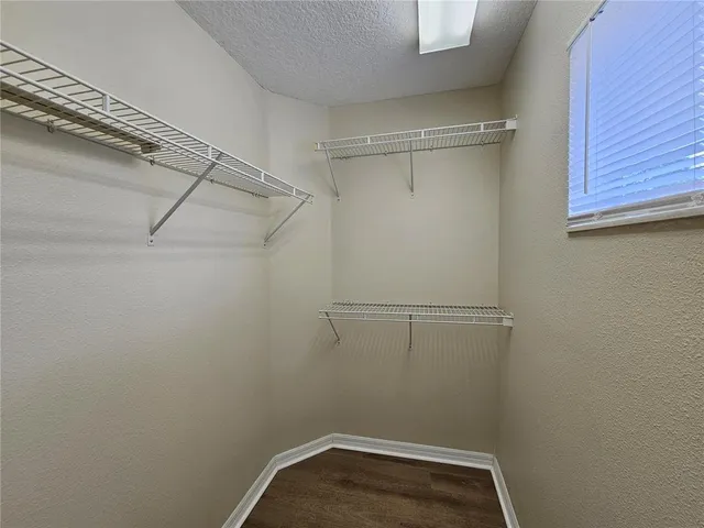 a view of a room with racks on the wall