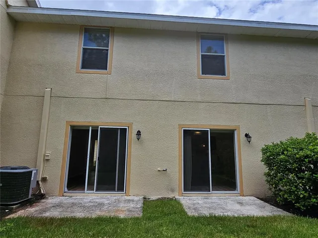 a view of a house with a yard and a table