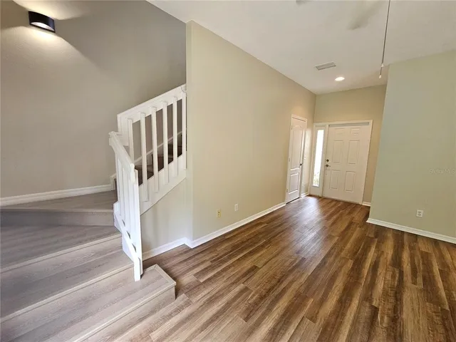 a view of entryway with wooden floor
