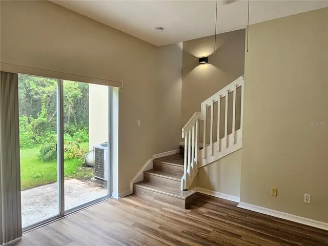 a view of entryway with wooden floor