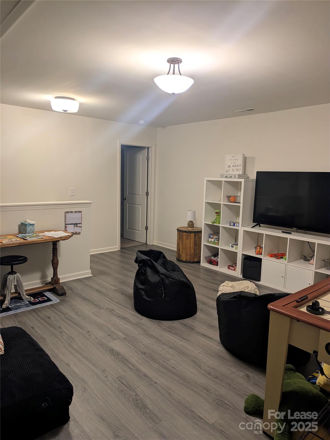 7481 Hartsfield Drive Lancaster, SC 29720 - Photo 13 of 27 a living room with furniture and a flat screen tv