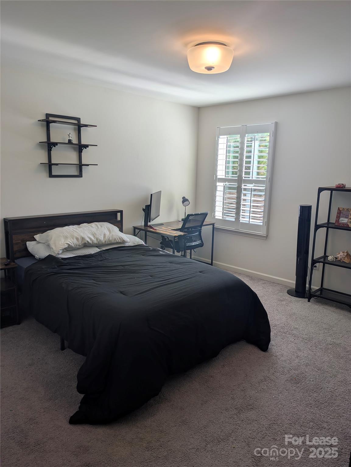 7481 Hartsfield Drive Lancaster, SC 29720 - Photo 22 of 27 a bedroom with a bed and a window