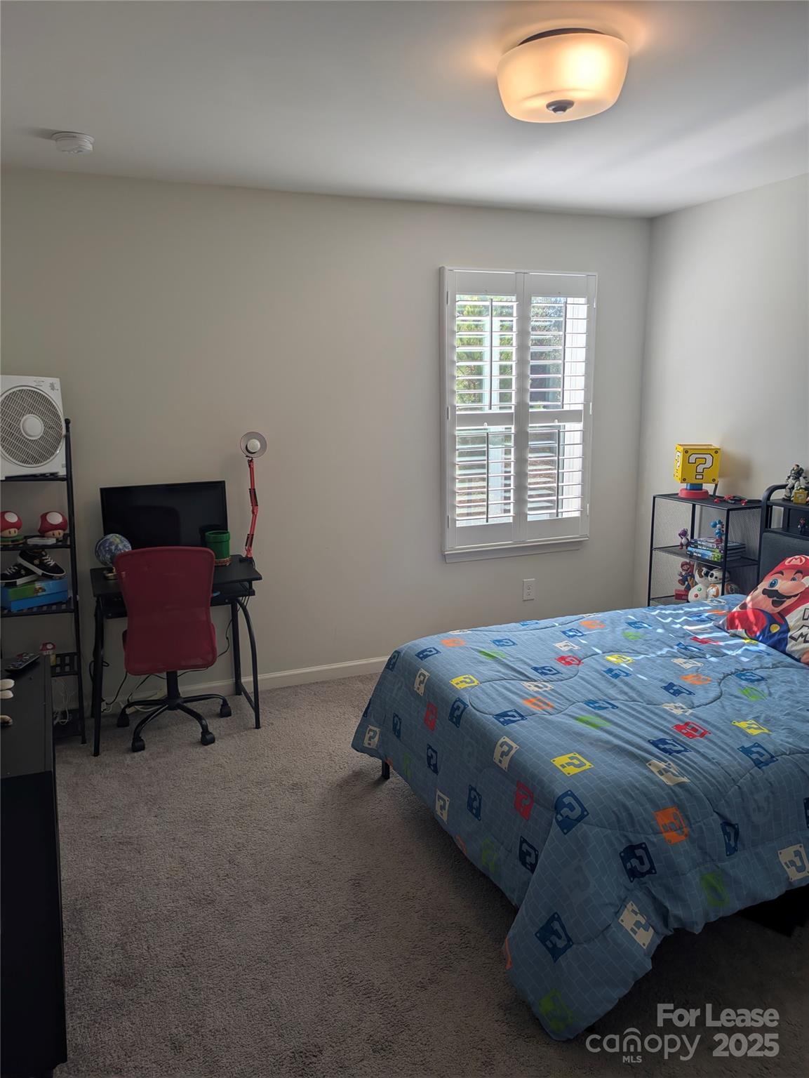 7481 Hartsfield Drive Lancaster, SC 29720 - Photo 23 of 27 a bed sitting in a bedroom next to a window