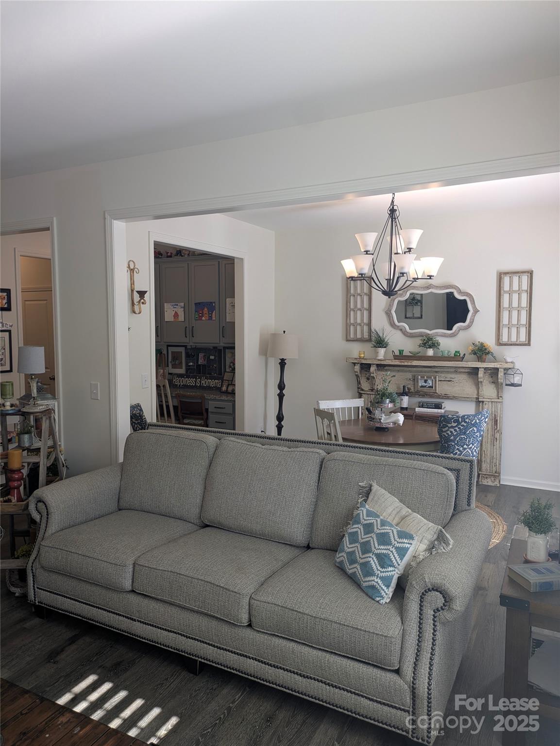 7481 Hartsfield Drive Lancaster, SC 29720 - Photo 6 of 27 a living room with furniture and a chandelier
