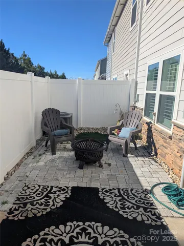 a view of a lounge chair and table in the balcony