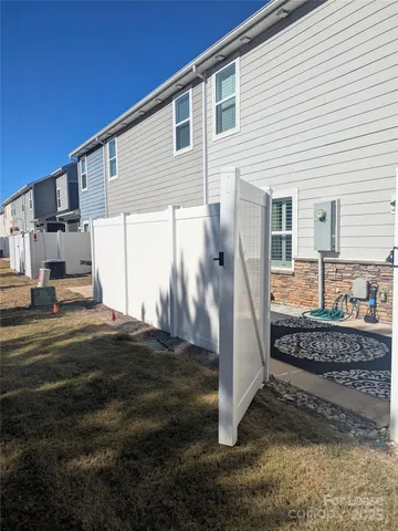 a view of a house with a house in the background
