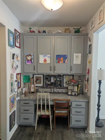 a room with furniture a washer and a large mirror