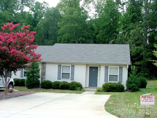 a house view with a garden space