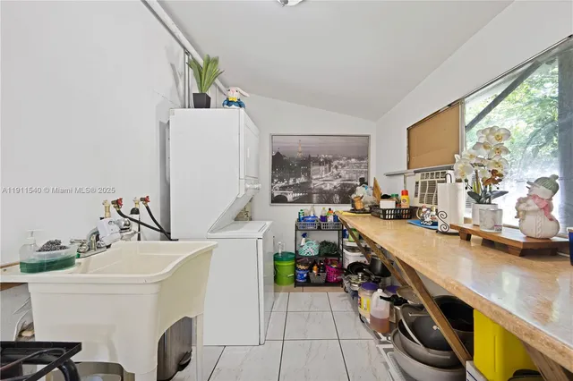 a view of a kitchen with a sink and dishwasher