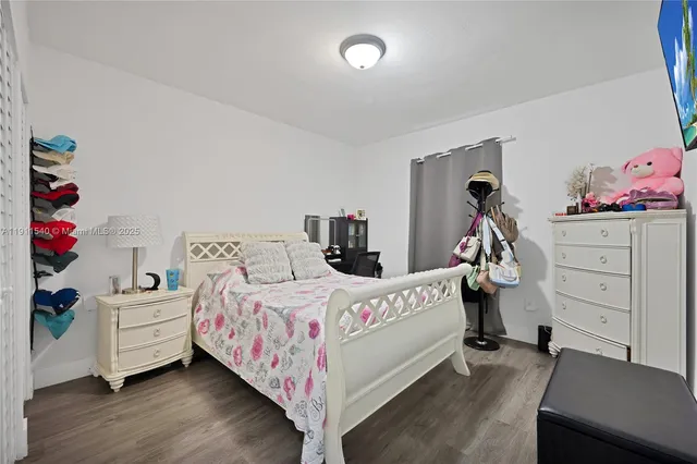 a bedroom with a bed and a closet