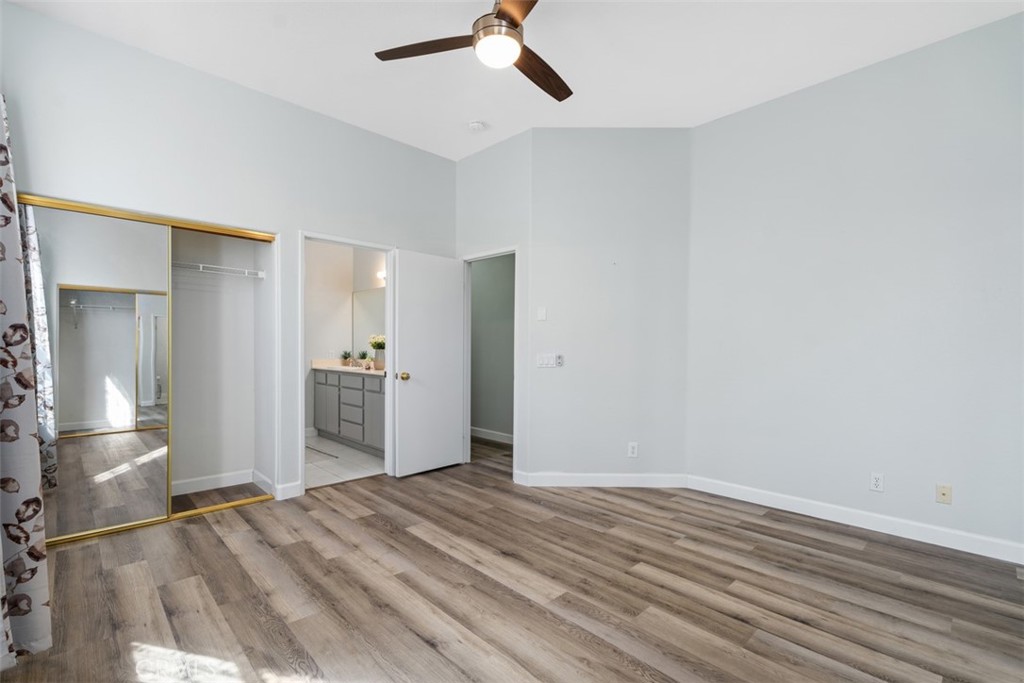 68262 Pasada Road Cathedral City, CA 92234 - Photo 19 of 27 wooden floor in an empty room with a bathroom
